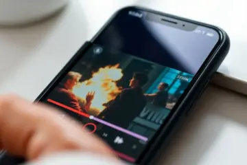 alt_text: A budget smartphone playing a vibrant HD movie in a clean, minimalist setup with soft natural lighting.