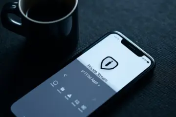 alt_text: A smartphone displays a minimalist "Private Stream" IPTV app with a shield icon, resting by coffee, evoking secure, calm viewing.